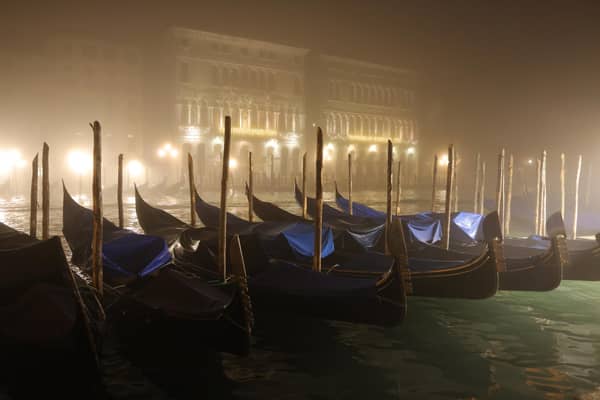 Gondolas lie moored in fog on the Grand Canal, Venice PIC: Sean Gallup/Getty Images