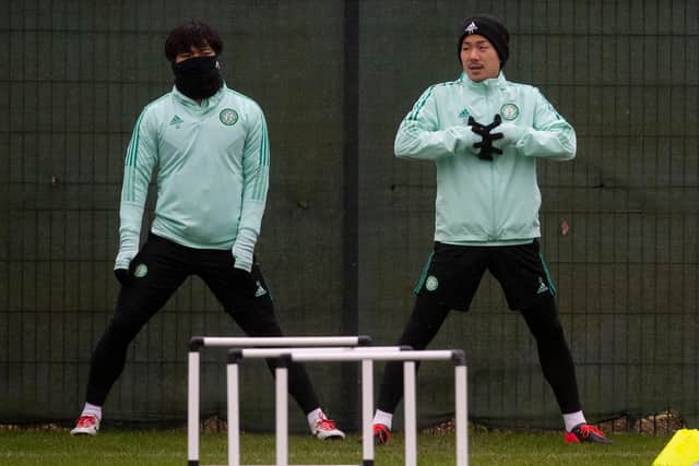 Yosuke Ideguchi, right, is back in the Celtic squad for the match against Dundee.