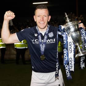 Dundee's Lee Ashcroft with the Championship trophy after the 5-3 win over Queen's Park at Ochilview. (Photo by Alan Harvey / SNS Group)