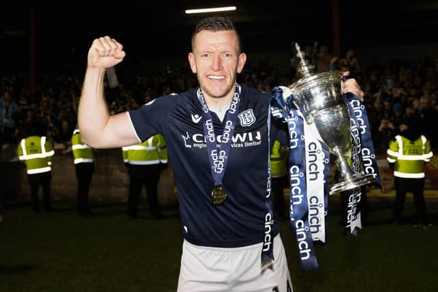 Dundee's Lee Ashcroft with the Championship trophy after the 5-3 win over Queen's Park at Ochilview. (Photo by Alan Harvey / SNS Group)