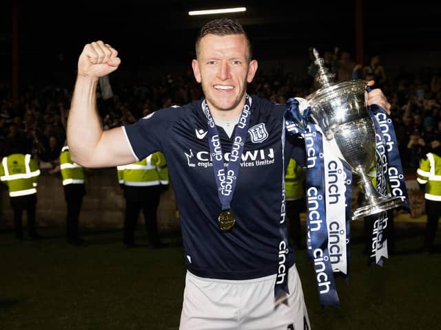 Dundee's Lee Ashcroft with the Championship trophy after the 5-3 win over Queen's Park at Ochilview. (Photo by Alan Harvey / SNS Group)