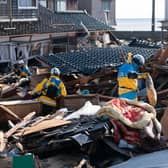 Police officers search for missing persons in the aftermath of an earthquake on New Year's Day in Suzu, Japan. A series of major earthquakes have reportedly killed at least 78 people, injured dozens more and destroyed a large amount of homes.