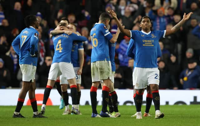 Rangers' players celebrate a famous win against Dortmund.