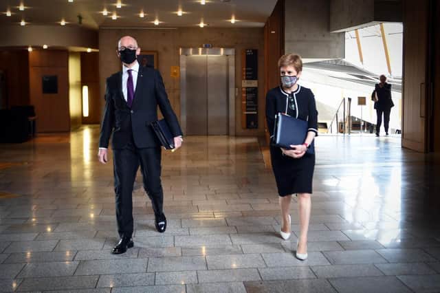 Deputy First Minister John Swinney alongside First Minister Nicola Sturgeon. Picture: Andy Buchanan/POOL/AFP via Getty Images
