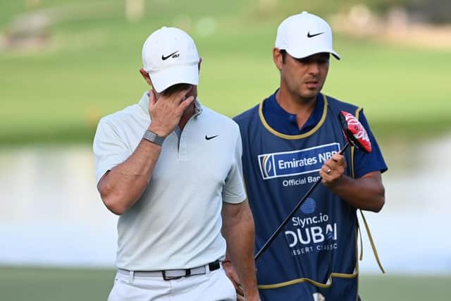 Rory McIlroy cuts a dejected figure leaving the 18th green at Emirates Golf Club. Picture: Ross Kinnaird/Getty Images.