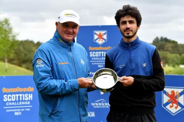 Paul Lawrie presents the to Javier Sainz after the Spaniard's win in the Farmfoods Scottish Challenge supported by The R&A at Newmachar. Picture: Mark Runnacles/Getty Images.