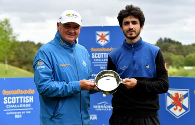 Paul Lawrie presents the to Javier Sainz after the Spaniard's win in the Farmfoods Scottish Challenge supported by The R&A at Newmachar. Picture: Mark Runnacles/Getty Images.