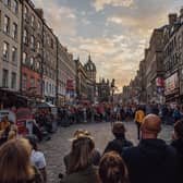 The Royal Mile thronged with visitors watching street theatre during the Edinburgh Festival Fringe. Picture: David Monteith-Hodge