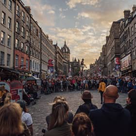 The Royal Mile thronged with visitors watching street theatre during the Edinburgh Festival Fringe. Picture: David Monteith-Hodge