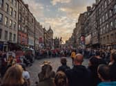 The Royal Mile thronged with visitors watching street theatre during the Edinburgh Festival Fringe. Picture: David Monteith-Hodge