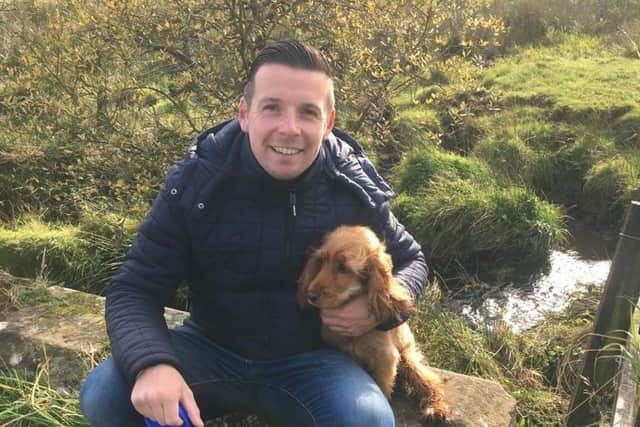 Allan with the family's beloved golden spaniel Penny.
