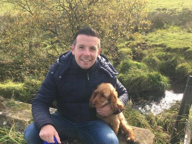 Allan with the family's beloved golden spaniel Penny.