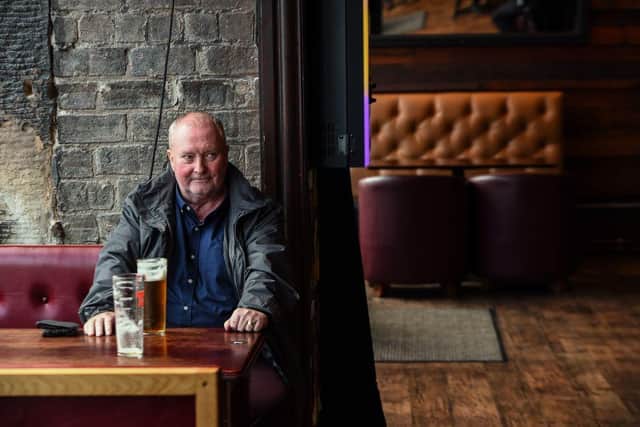 A customer sits with his beer in Jackson's Bar in the city centre of Glasgow. Photo by ANDY BUCHANAN/AFP via Getty Images