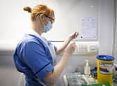 Nurse Eleanor Pinkerton prepares a coronavirus vaccine. Picture: PA