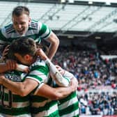 Celtic's Alistair Johnston jumps on top of his team-mates following Cameron Carter-Vickers' goal in the 3-0 win over Hearts.