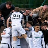 Edinburgh City's Innes Murray (29) celebrates his goal with fans against Annan Athletic.