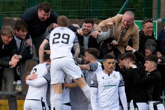 Edinburgh City's Innes Murray (29) celebrates his goal with fans against Annan Athletic.