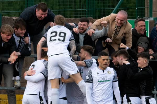 Edinburgh City's Innes Murray (29) celebrates his goal with fans against Annan Athletic.