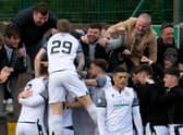 Edinburgh City's Innes Murray (29) celebrates his goal with fans against Annan Athletic.