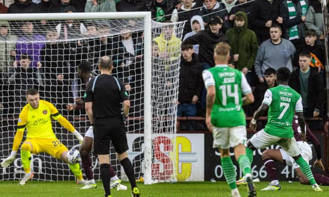 Elie Youan struck twice to rescue a point for Hibs against Hearts at Tynecastle.