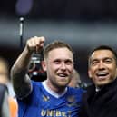 GLASGOW, SCOTLAND - MAY 05: Scott Arfield of Rangers and Giovanni van Bronckhorst, Manager of Rangers celebrate after victory in the UEFA Europa League Semi Final Leg Two match between Rangers and RB Leipzig at Ibrox Stadium on May 05, 2022 in Glasgow, Scotland. (Photo by Ian MacNicol/Getty Images)