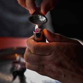 A drug user prepares cocaine before injecting. Picture: Jeff J Mitchell/Getty Images