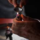 A drug user prepares cocaine before injecting. Picture: Jeff J Mitchell/Getty Images