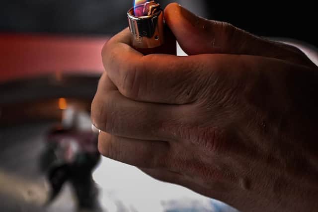 A drug user prepares cocaine before injecting. Picture: Jeff J Mitchell/Getty Images