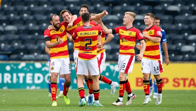 Partick's Aaron Muirhead (centre) celebrates his equaliser at Kilmarnock. (Photo by Ewan Bootman / SNS Group)