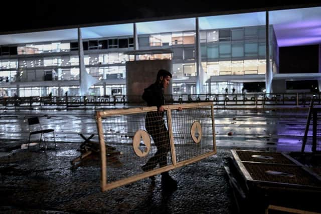 Security forces remove barricades outside Planalto Palace after supporters of former Brazilian President Jair Bolsonaro, who invaded the building, were subdued, in Brasilia this week. Picture: AFP via Getty Images