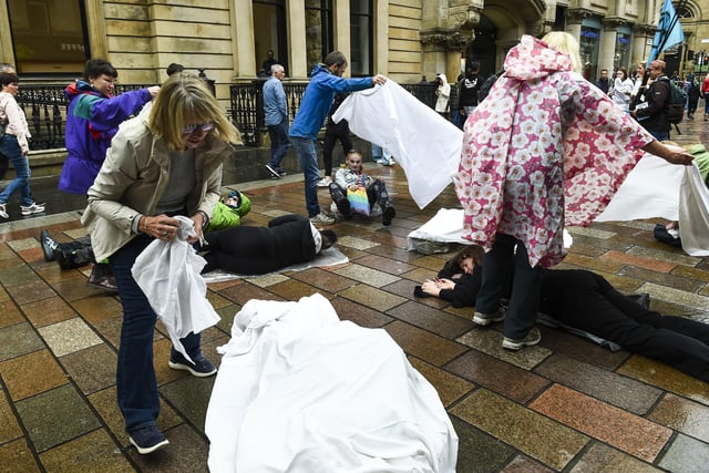 Shoppers walking past the protest on Buchanan Street