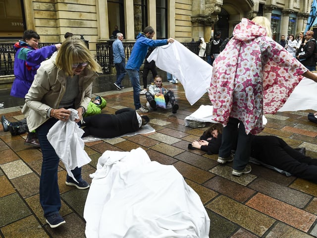 Shoppers walking past the protest on Buchanan Street