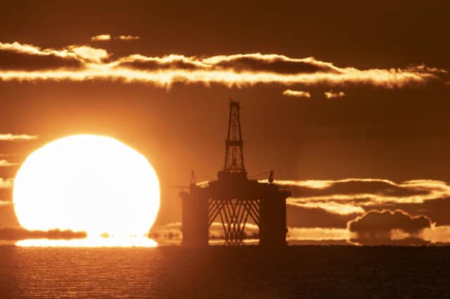 The sun rises behind a redundant oil platform moored in the Firth of Forth near Kirkcaldy, Fife.