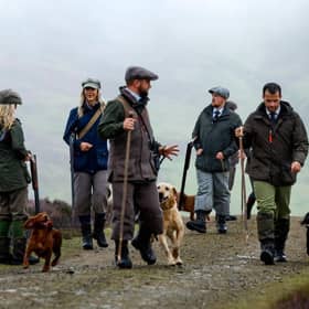 Members of a shooting party prepare to mark the Glorious Twelfth, the annual start of the grouse shooting season on an estate in the Angus Glens (Photo by Jeff J Mitchell/Getty Images)