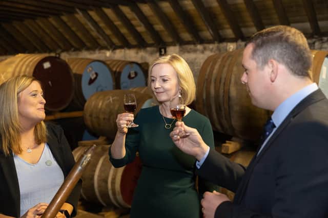 ELGIN, SCOTLAND - AUGUST 16: Conservative Leadership hopeful Liz Truss and leader of the Scottish Conservative Party Douglas Ross visit the BenRiach Distillery on August 16, 2022 in Elgin, Scotland and is accompanied by Douglas Ross, leader of the Scottish Conservatives along with Laura Tolmie of BenRiach. Foreign Secretary, Liz Truss and former Chancellor Rishi Sunak are vying to become the new leader of the Conservative Party and the UK's next Prime Minister. (Photo by Paul Campbell/Getty Images)