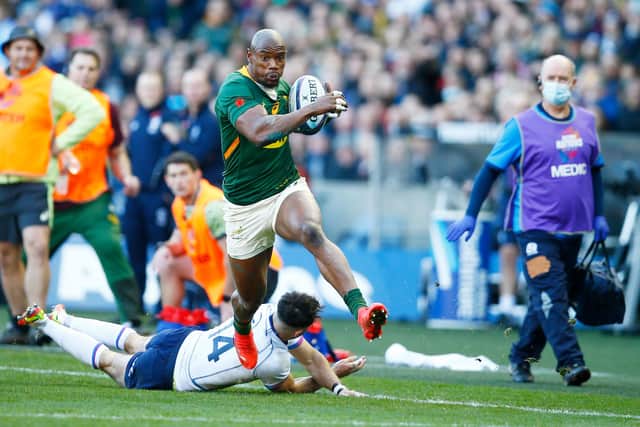 Makazole Mapimpi gallops past Rufus McLean for South Africa's opening try. (Photo by Steve Haag/Gallo Images/Getty Images)