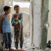 Palestinian children amid the rubble of a mosque-turned-shelter in Deir al-Balah on the central Gaza Strip. Picture: Moiz Salhi/Middle East Images/AFP via Getty Images