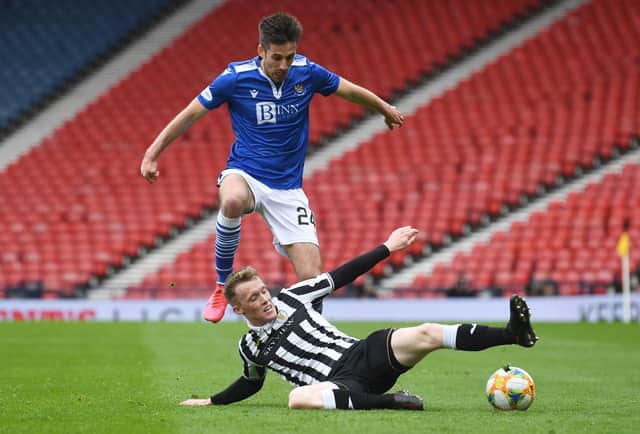 St Johnstone's Callum Booth (left) is tackled by St Mirren's Jake Doyle-Hayes during the Perth club's Scottish Cup semi-final victory over St Mirren that now sees only old club Hibs stand in the McDiarmid Park side's way of an historic double. (Photo by Craig Foy / SNS Group)