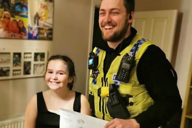 Ellen poses with PC Suddaby.  Picture: SWNS