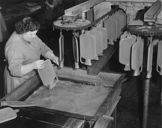 Making hot water bottles at the North British Rubber Company in November 1951.