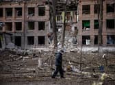 A man walks in front of a destroyed building after a Russian missile attack in the town of Vasylkiv, near Kyiv. Picture: Dimitar Dilkoff/AFP/Getty