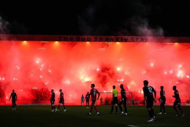 Rangers fans light up the Bob Shankly Stand with pyro during the match against Dundee at Dens Park. (Photo by Ross Parker / SNS Group)