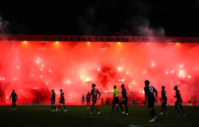 Rangers fans light up the Bob Shankly Stand with pyro during the match against Dundee at Dens Park. (Photo by Ross Parker / SNS Group)