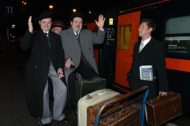 Barnaby Power and Steven McNicoll recreate the arrival of Laurel and Hardy at Edinburgh's Caledonian train station in 1954 for the 2004 production.