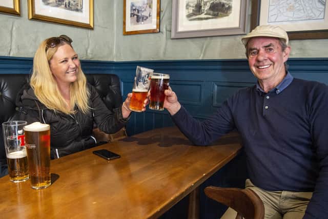 Customers have a drink inside the Scotsman's Lounge in Edinburgh yesterday (Picture: Lisa Ferguson)