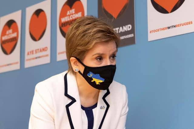 Scottish First Minister Nicola Sturgeon meets with Ukrainian nationals, staff and volunteers working with the Scottish Refugee Council in Glasgow to prepare for the arrival of people displaced from Ukraine, in Glasgow (Photo by Robert Perry / POOL / AFP).