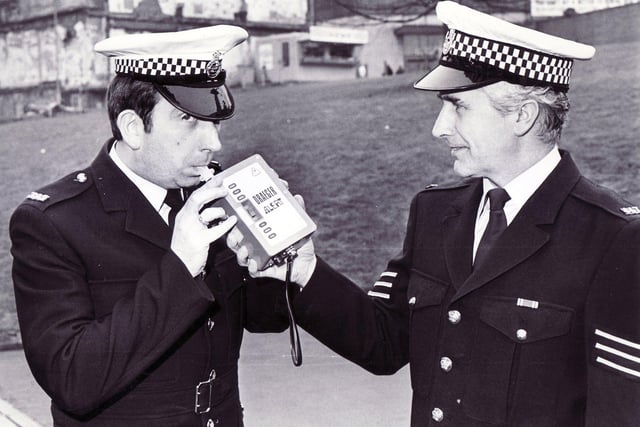 PC Charles Auty (left) and Sgt John Fryer of South Yorkshire Police in Sheffield with the Draeger electronic roadside breathalyser box which was replacing the bag and tube in March 1986