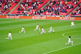 England players take a knee ahead of a Euro 2020 game to protest against racism (Picture: Mike Egerton/PA)