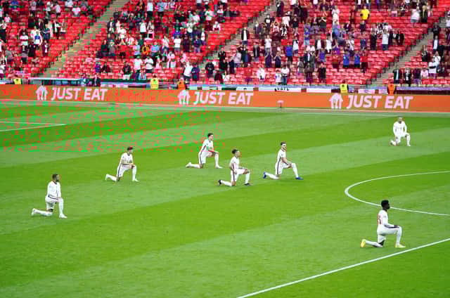 England players take a knee ahead of a Euro 2020 game to protest against racism (Picture: Mike Egerton/PA)