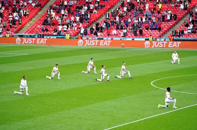 England players take a knee ahead of a Euro 2020 game to protest against racism (Picture: Mike Egerton/PA)